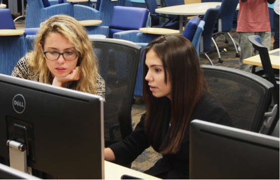 girls who code help student at fiu photo