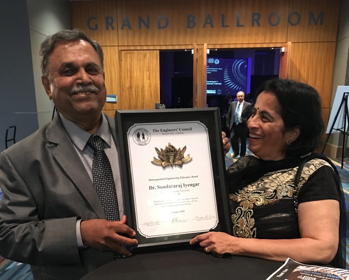 Photo of Iyengar hold his Distinguished Engineering Educator Award for 2018 presented by the Engineer’s Council Award