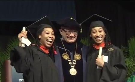 Photo of the Witherspoon Twins at receiving their Masters in Information Technology degree