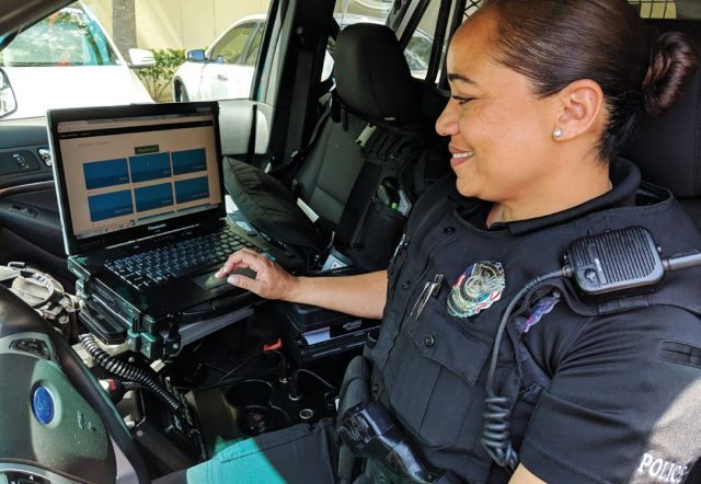 Photo of Police officer using the Virtual Roll Call app